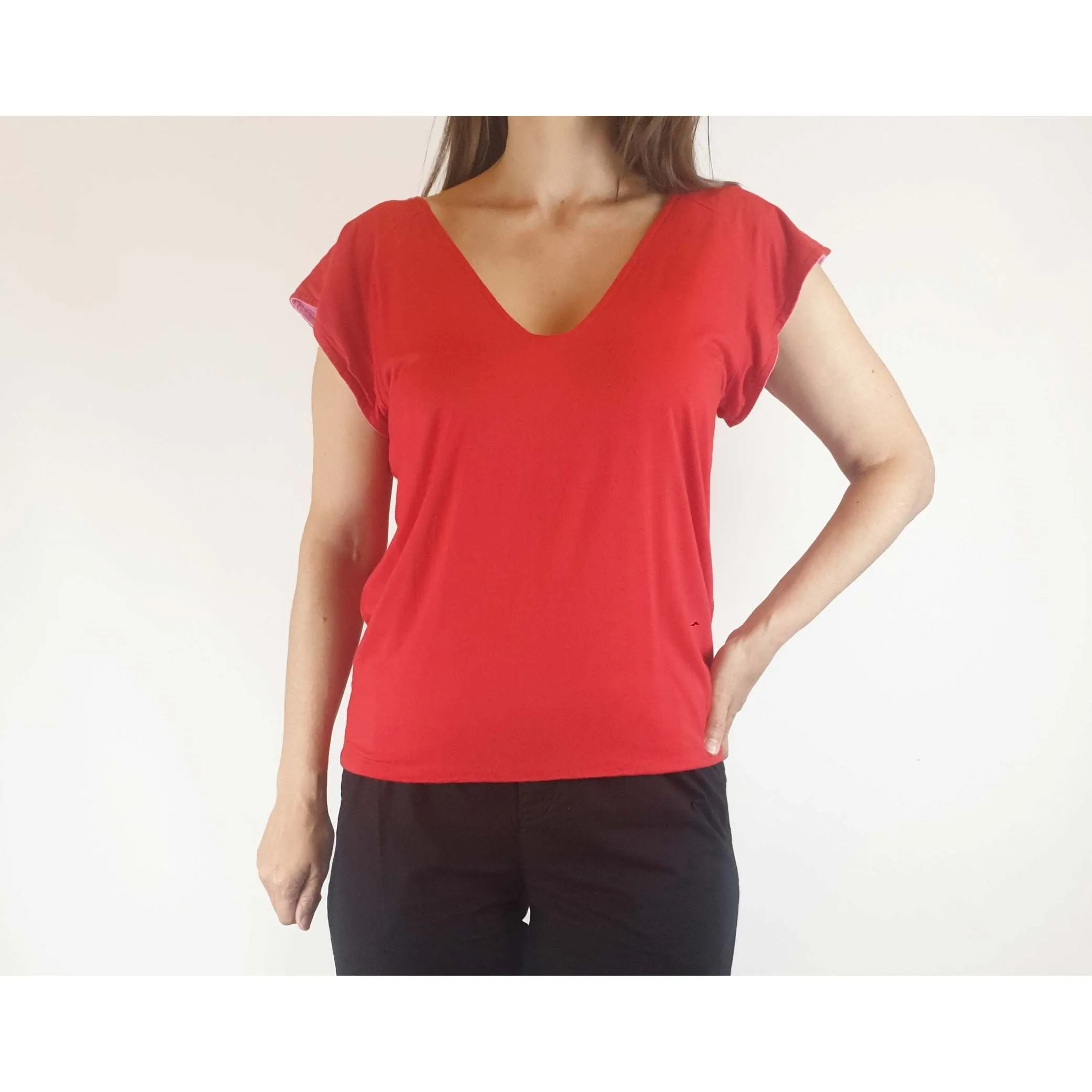 Reversible tee shirt top with red and pink sides best fits size 8